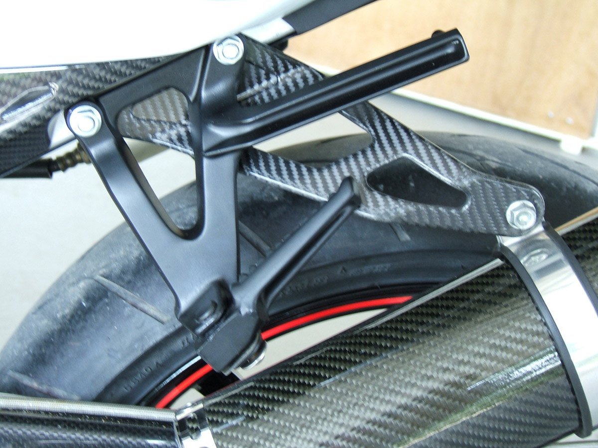 Exhaust Stay (Carbon), NC30/35 - Image 2